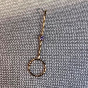 Gold plated with purple stone cigarette holder/joint holder ring.